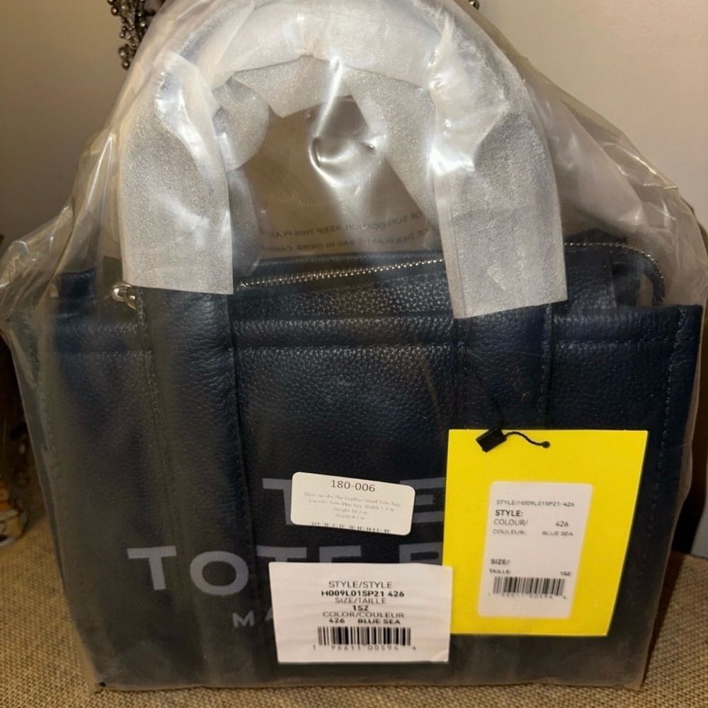 Marc Jacob’s Blue The Tote Bag, small

Handle drop: 4”
L:  10”
W:  3 1/2”
D:  8”